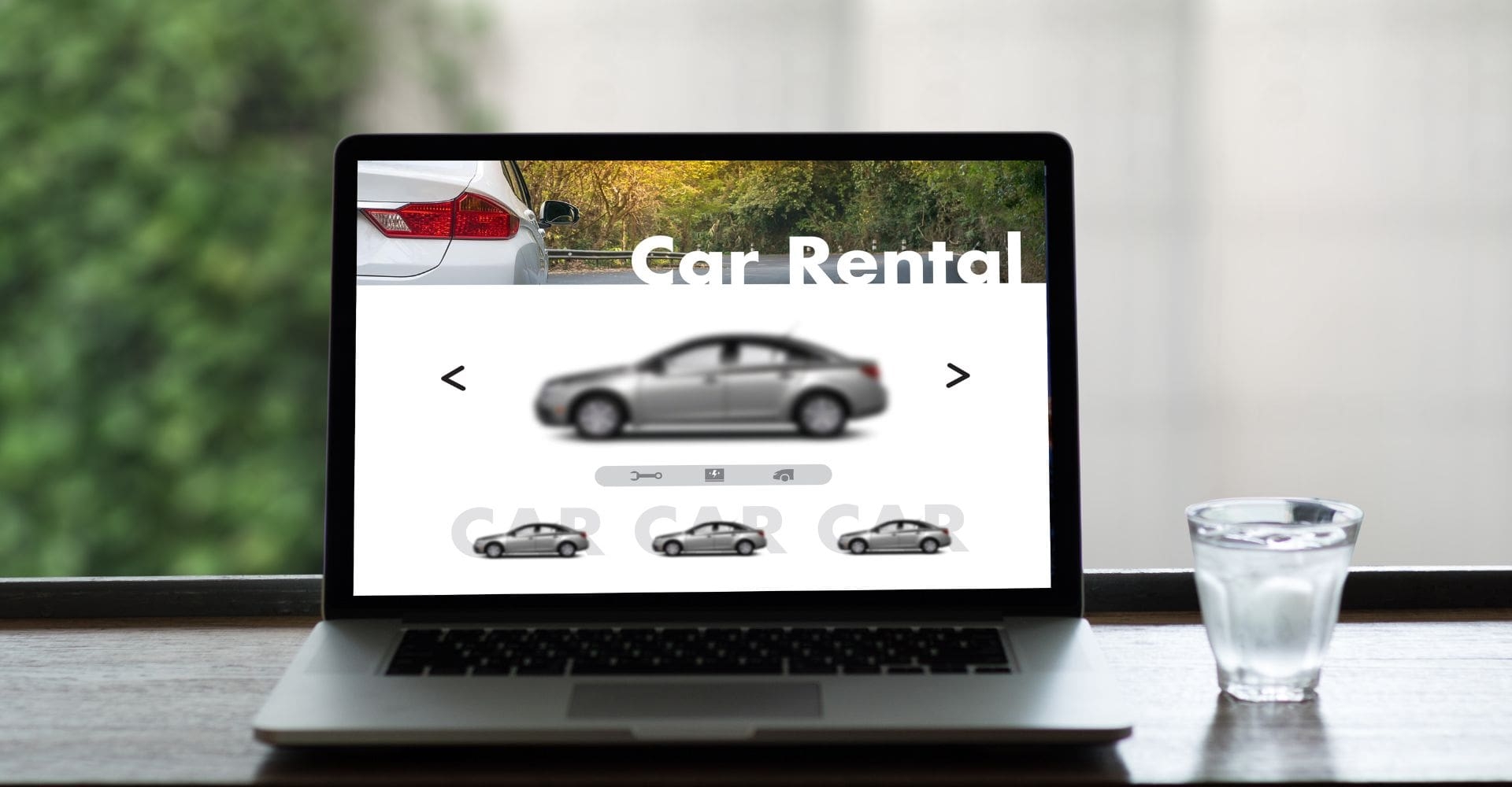 open laptop screen with a website featuring "car rentals" open 