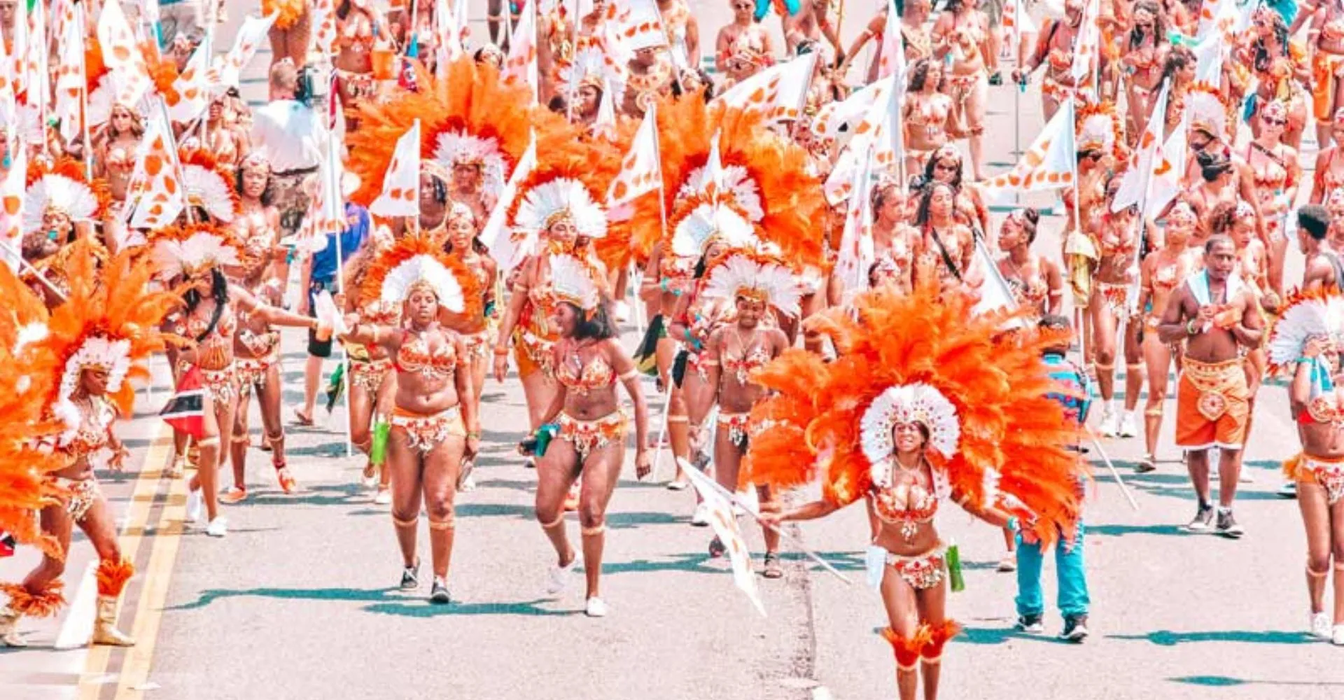 a group of performers dressed in bright colors at a local cultural festival 