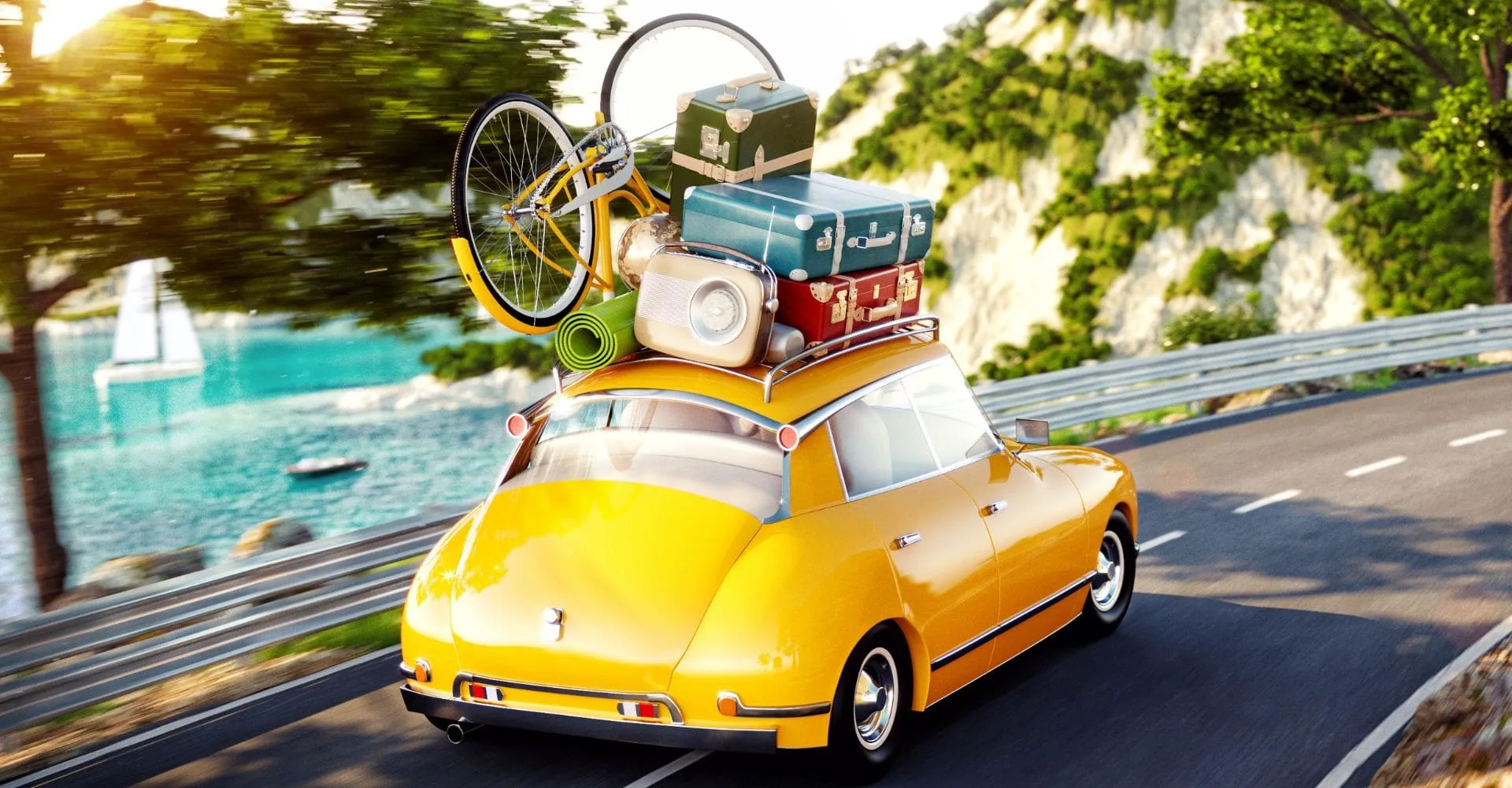A yellow car with luggage on its roof driving along a scenic road under a clear blue sky