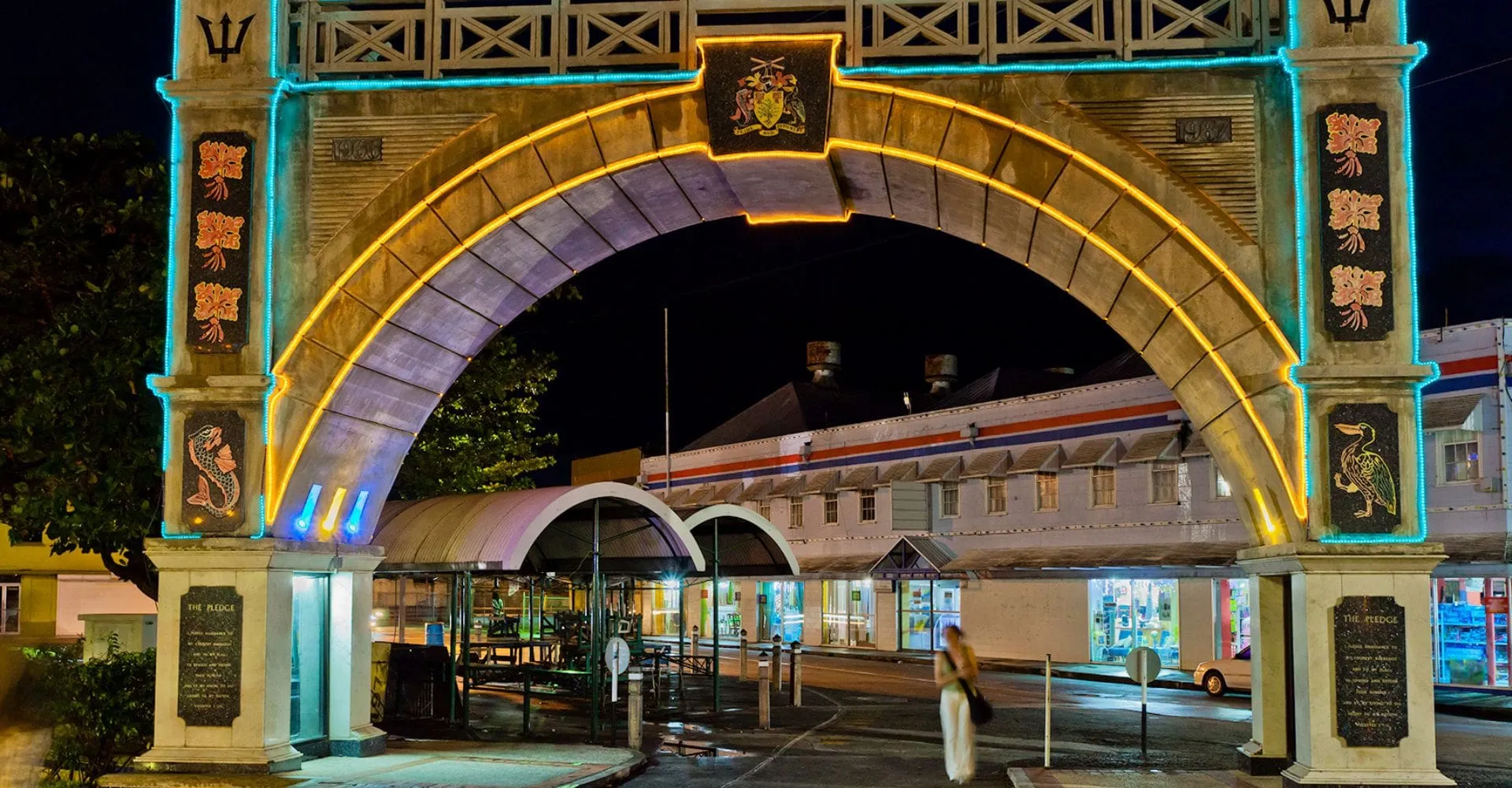 A large illuminated archway adorned with lights, creating a festive atmosphere
