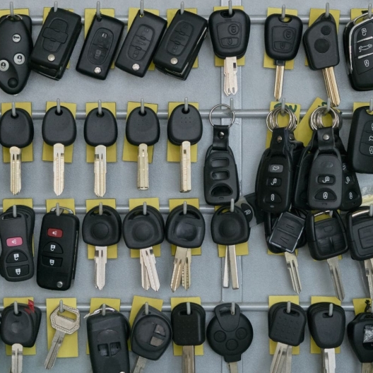 rows and rows of black car keys hanging on the wall