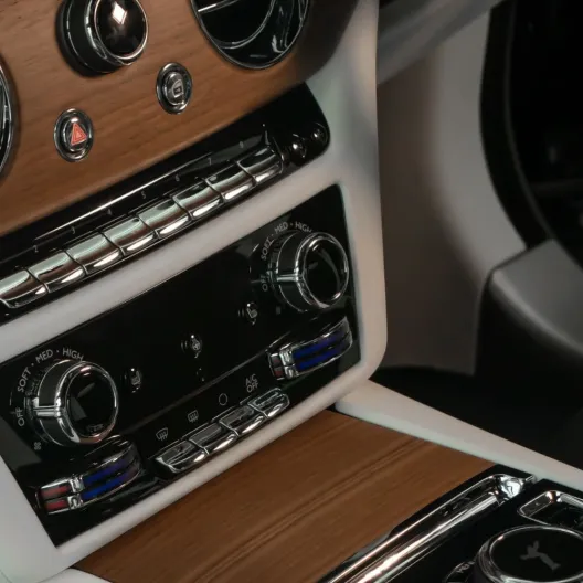 interior of a luxury car with wood panel accents 