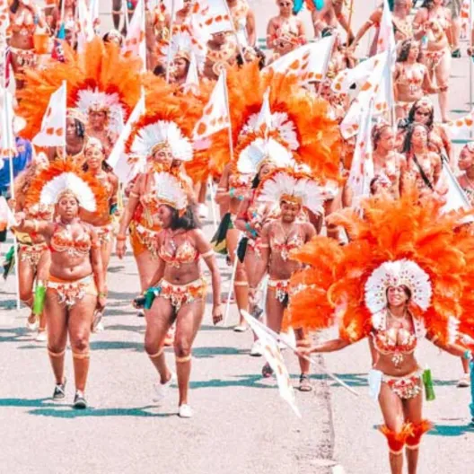 a group of performers dressed in bright colors at a local cultural festival 